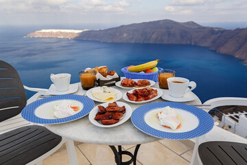 Table and breakfast for two on a high terrace above the sea