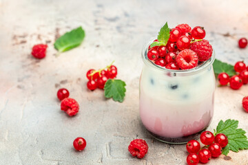 berries Yogurt. Healthy layered dessert with yogurt, jam, red currant and raspberries. Natural detox. banner, menu, recipe place for text, top view