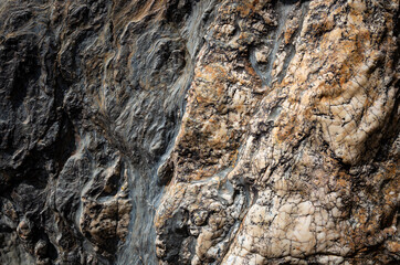 background of a dark shale stone with inlaid quartzites
