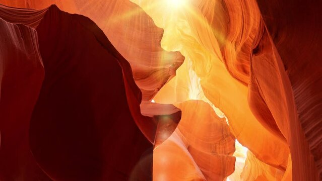 Various red and orange rocks in antelope canyon. Midday sun hits the antelope canyon whimsically illuminating canyon walls. Red walls of Antelope Canyon in Arizona, USA, United States