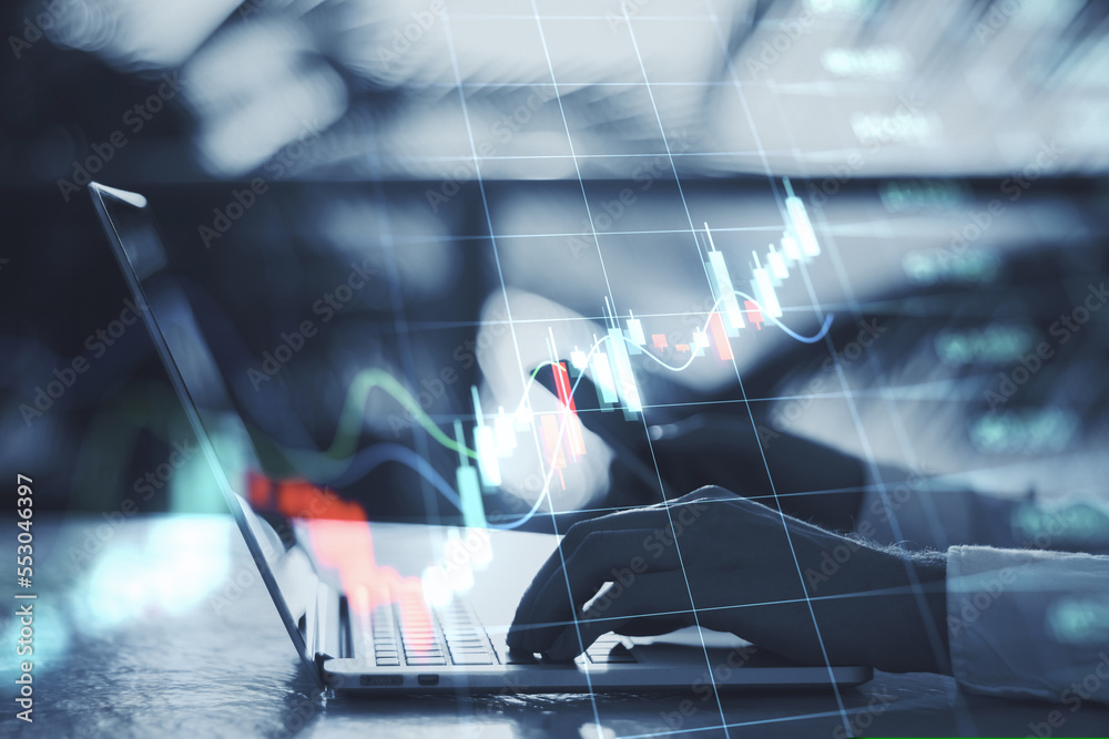 Poster close up of backlit hands using laptop and cellphone on desktop with glowing business forex chart ho