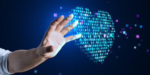 Close up of male hand using abstract glowing blue pixel heart on blurry background. Health, cardiology and game interface concept. - obrazy, fototapety, plakaty