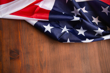 Flag of america on a brown background. View from above. Wood texture . Place for text.