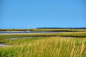 Tidal flats and sail boat