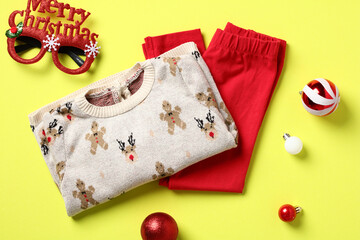Christmas holiday childrens outfit top view. Kids Christmas clothes, festive baby wear.