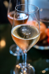Tasting of brut and rose champagne sparkling wine produced by traditional method in underground caves in Champagne, France