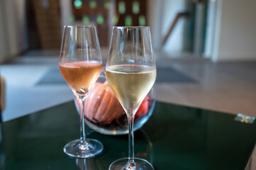 Tasting of brut and rose champagne sparkling wine produced by traditional method in underground caves in Champagne, France