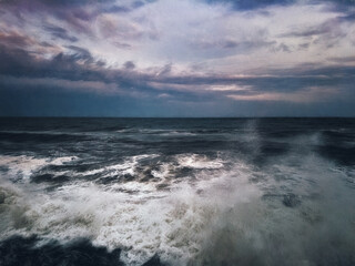 Storm on the sea against the background of clouds. Illustration