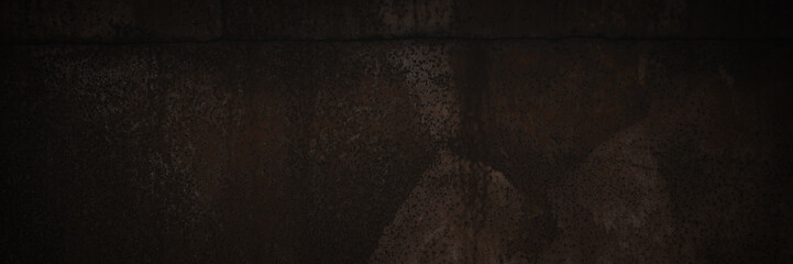 Old rusted metal texture. Rusty iron wall. Rough faded metal surface with spots, noise and grain. Dark wide panoramic background for grunge design. Shaded vintage texture with vignette.