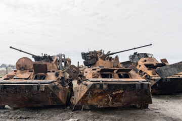 Fototapeta na wymiar Destroyed infantry fighting vehicle's (IFV). Remains of military vehicles in a junkyard.
