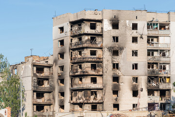 An exterior view of a high-rise residential building heavily damaged by a Russian artillery shells in Borodianka