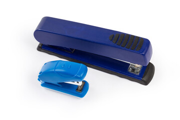 Two small and big paper staplers on a white background