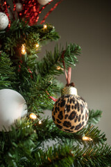 Holiday ornaments hanging on a Christmas tree. Decorations for the season.