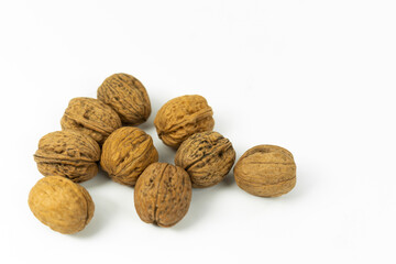 Walnuts in group on white background with copyspace. High quality photo