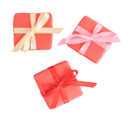 Three small red gift boxes, top view, isolated on white or transparent background.