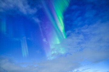 Sky background with northern lights. Aurora borealis. Northern lights as a background. Night winter landscape with aurora. Natural background.