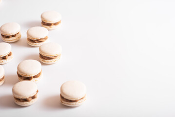 Tasty sweet macarons. Macaroons on white background. Copy space