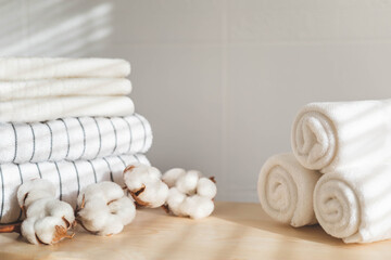 Bath fresh towels pile soft textile cotton body care neatly folded white gray laundry flower shelf