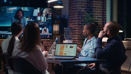 Employees greeting remote team in videoconference, company strategy discussion in teleconference. Diverse office workers chatting in online business meeting using videocall application