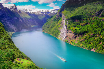 Peaceful Geirangerfjord with boat and waterfall, Norway , Scandinavia