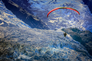 Paragliding above Mont Blanc massif alpine landscape , Chamonix, French Alps