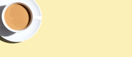 A cup of coffee overhead view on desk - flat lay