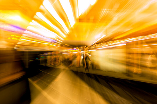 The interior of a metro station in paris with optical zoom effect and motion blurred image