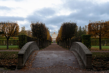 View of the Hermitage Alley strewn with fallen leaves and the Catherine Palace in the Catherine...