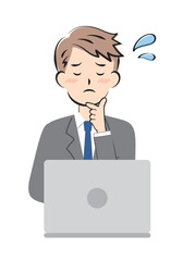 パソコン操作で困っているスーツ姿の若い男性