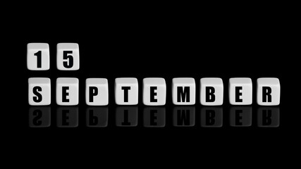 September 15th. Day 15 of month, Calendar date. White cubes with text on black background with reflection. Autumn month, day of year concept