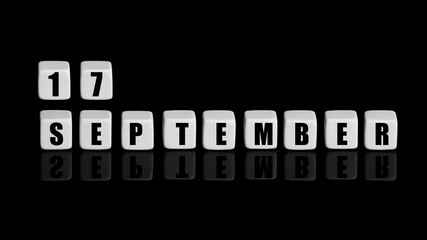September 17th. Day 17 of month, Calendar date. White cubes with text on black background with...