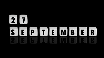 September 27th. Day 27 of month, Calendar date. White cubes with text on black background with reflection. Autumn month, day of year concept