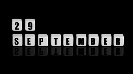 September 29th. Day 29 of month, Calendar date. White cubes with text on black background with reflection. Autumn month, day of year concept