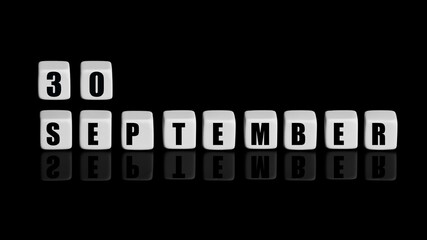September 30th. Day 30 of month, Calendar date. White cubes with text on black background with reflection. Autumn month, day of year concept
