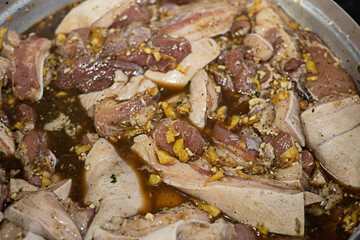 Fresh pork marinated in sauces, seasonings or spices close-up photography