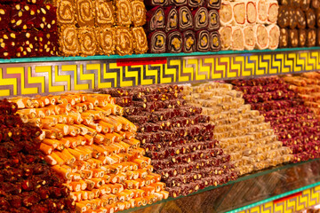 Turkish finger delights and lokum rolls on market stall at grand bazaar in Istanbul. Popular sweet...