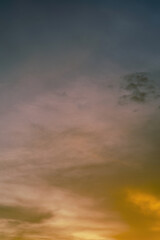 Golden sunset sky background with beautiful clouds.