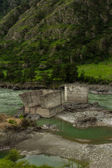 Mountain river Katun and broken bridge in Altay Russia