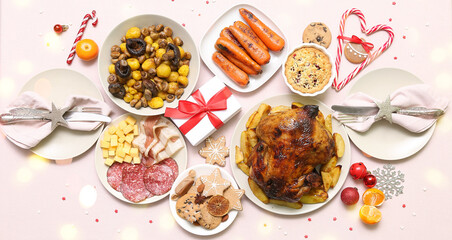 Tasty dishes for Christmas dinner on light background, top view