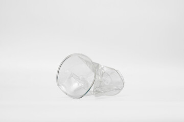 plastic cup crumpled in a white background