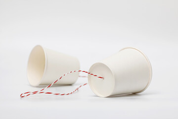 Implementing the concept of a communication system using white paper cups and strings