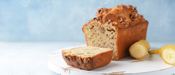 Tasty banana bread on light background with space for text
