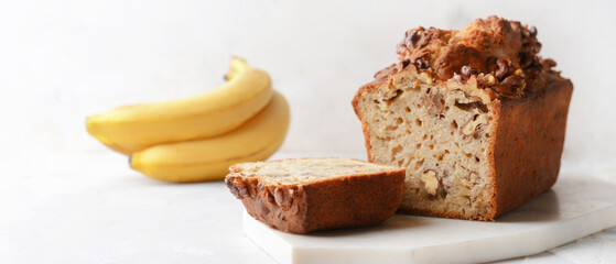 Tasty banana bread on light background