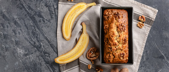 Tasty banana bread on dark background with space for text