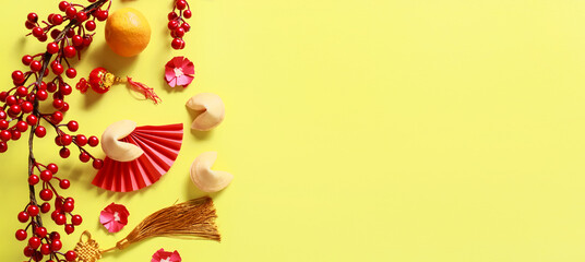 Obraz premium Chinese symbols on yellow background with space for text, top view