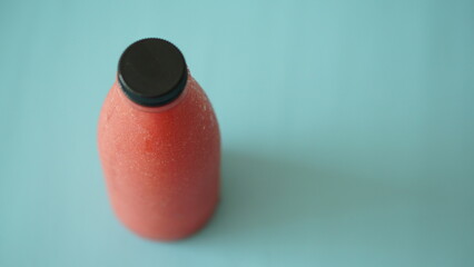 A bottle of red guava juice