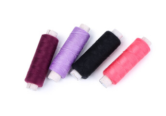 Set of thread spools on white background