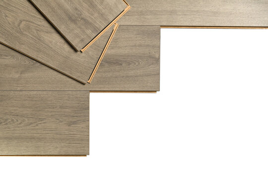 Installation of floating floor, underlay with sheets of laminate. Home improvement concept. Banner with copy space.