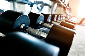 Rows of dumbbells in the gym