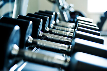 Rows of dumbbells in the gym